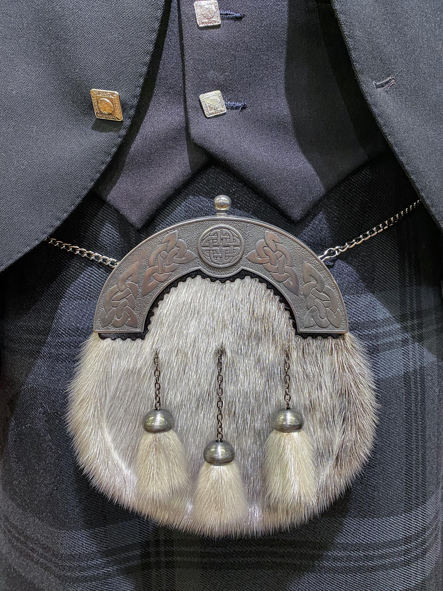 embroidered jacket cuff detail, close-up