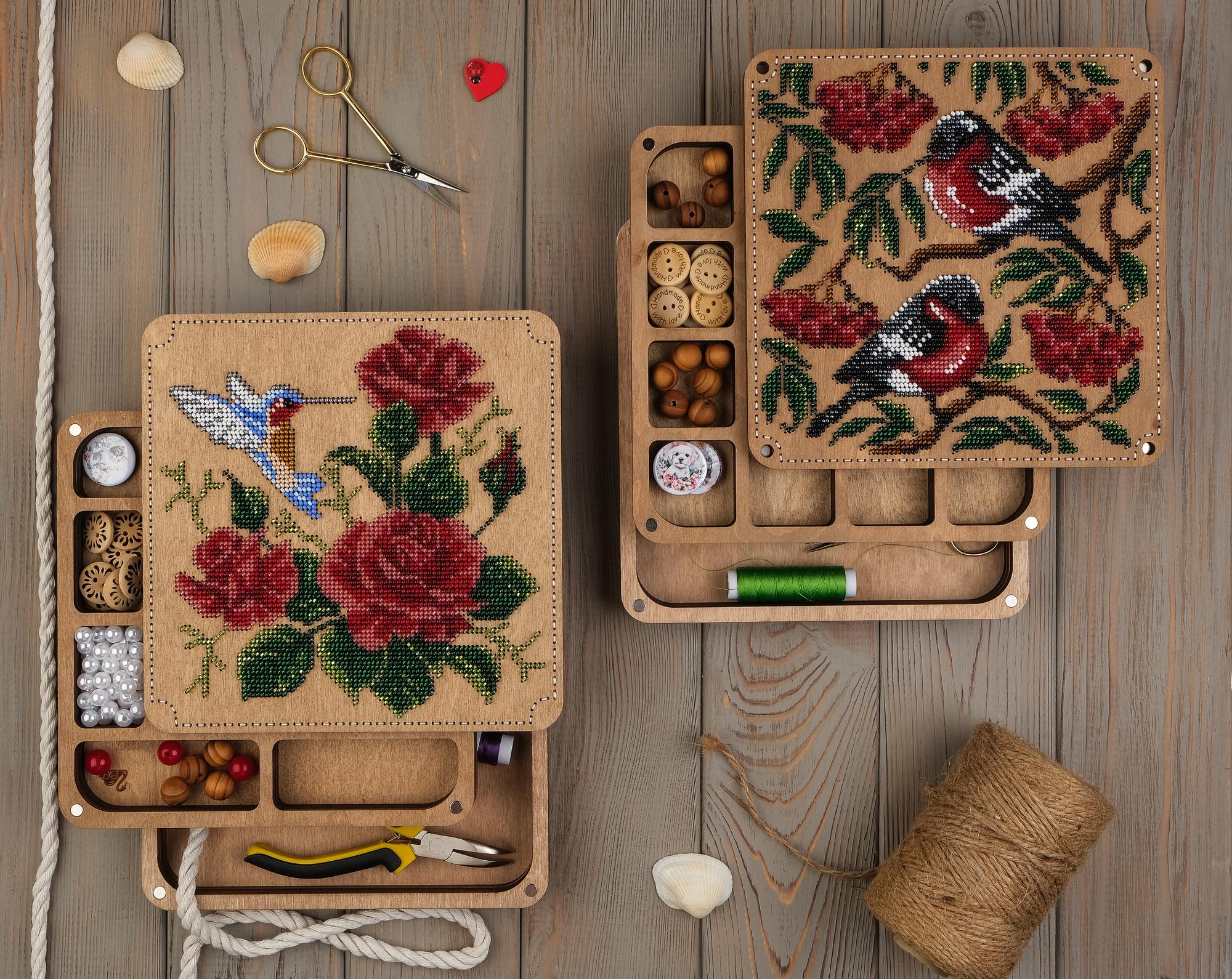 collection of embroidered samplers on table